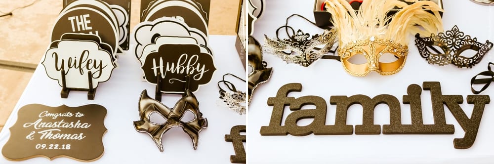 Photo booth props including signs labeled "Wifey," "Hubby," and "family," alongside decorative masks, celebrating the wedding of Anastasha and Thomas.