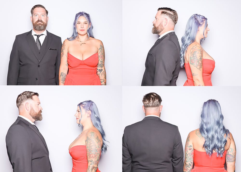 Couple posing in a photo booth, featuring four angles; man in a black suit and woman in a red dress with tattoos, showcasing creative poses and expressions.