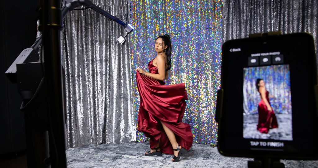woman in flowing dress in a glambot booth rental