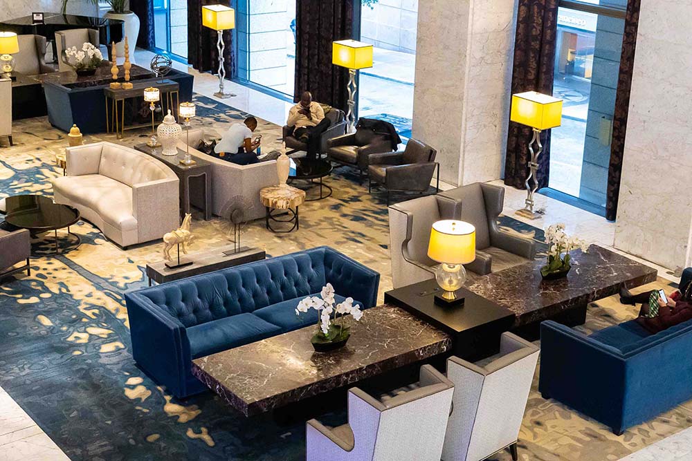 Hotel Nikko San Francisco lobby featuring modern furniture, elegant seating areas, and stylish decor, ideal for business events and gatherings.