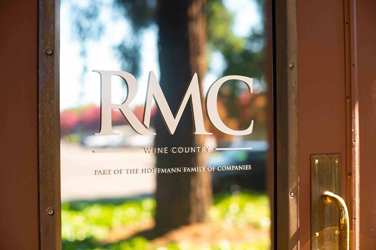 RMC Wine Country logo on office door, representing destination management services in Sonoma, emphasizing authenticity and connection.
