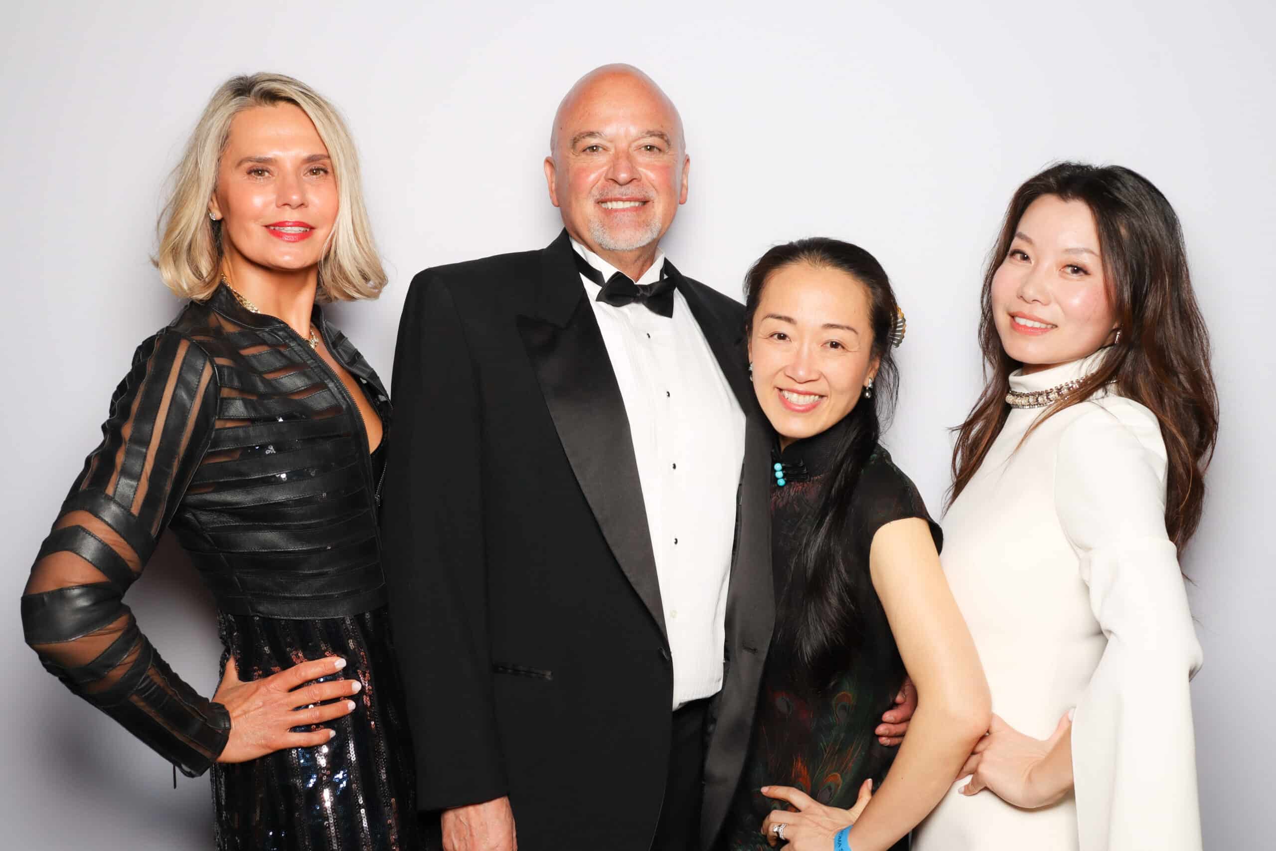 Glam booth portraits of guests at a sophisticated event, polished and delivered instantly.