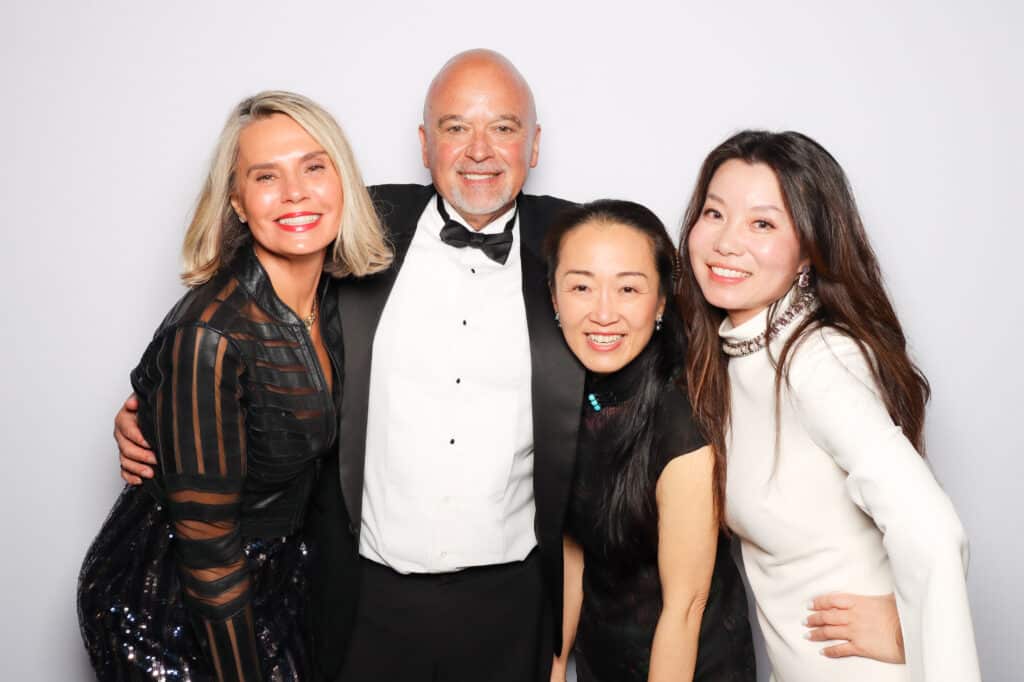 Corporate event photo activation with guests posing for branded photos