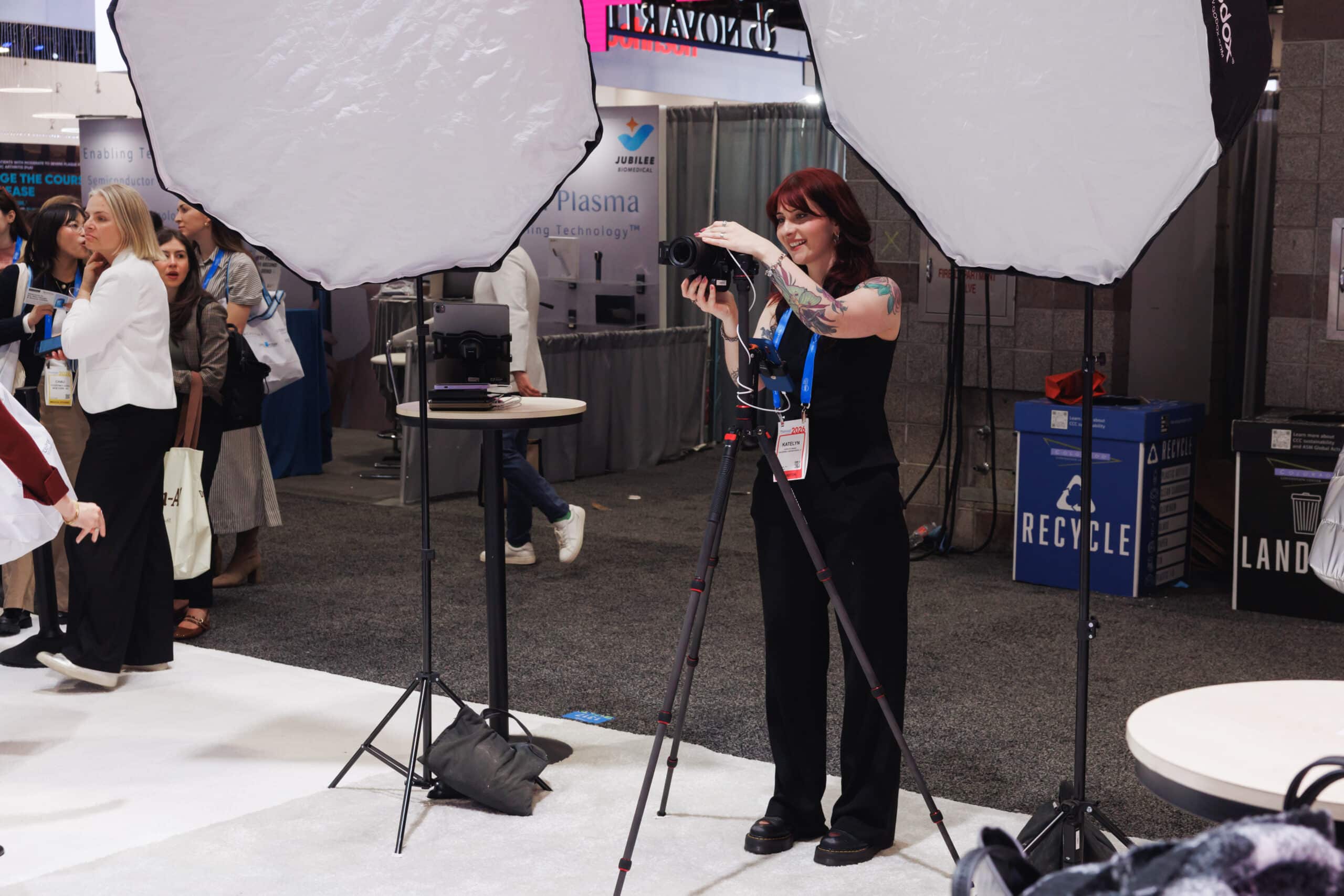 Pop Life Photo photographer capturing editorial portraits at Galderma event, controlled lighting setup and branding.