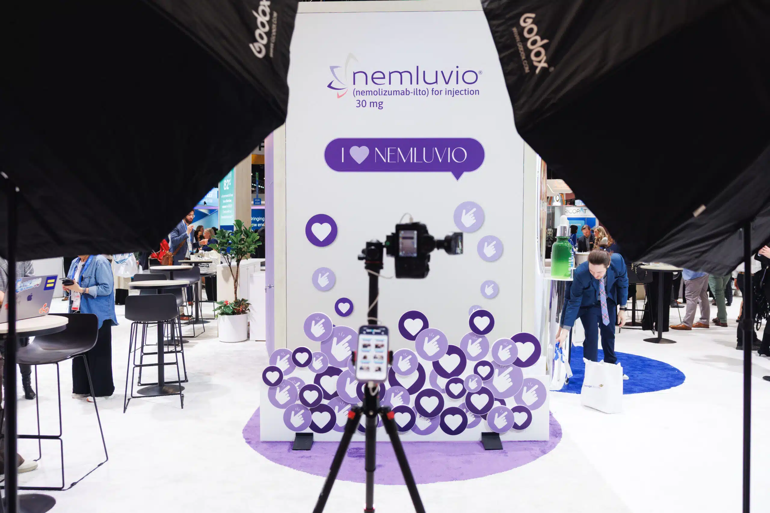Nemlvuio branded photo booth activation with editorial lighting and on-site portrait delivery.