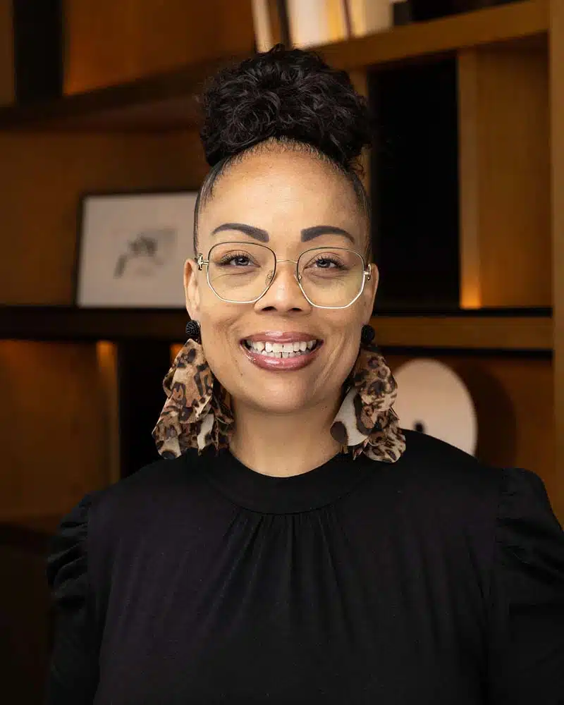 Professional headshot portrait of a smiling woman, Pop Life Photo on-site photography service.