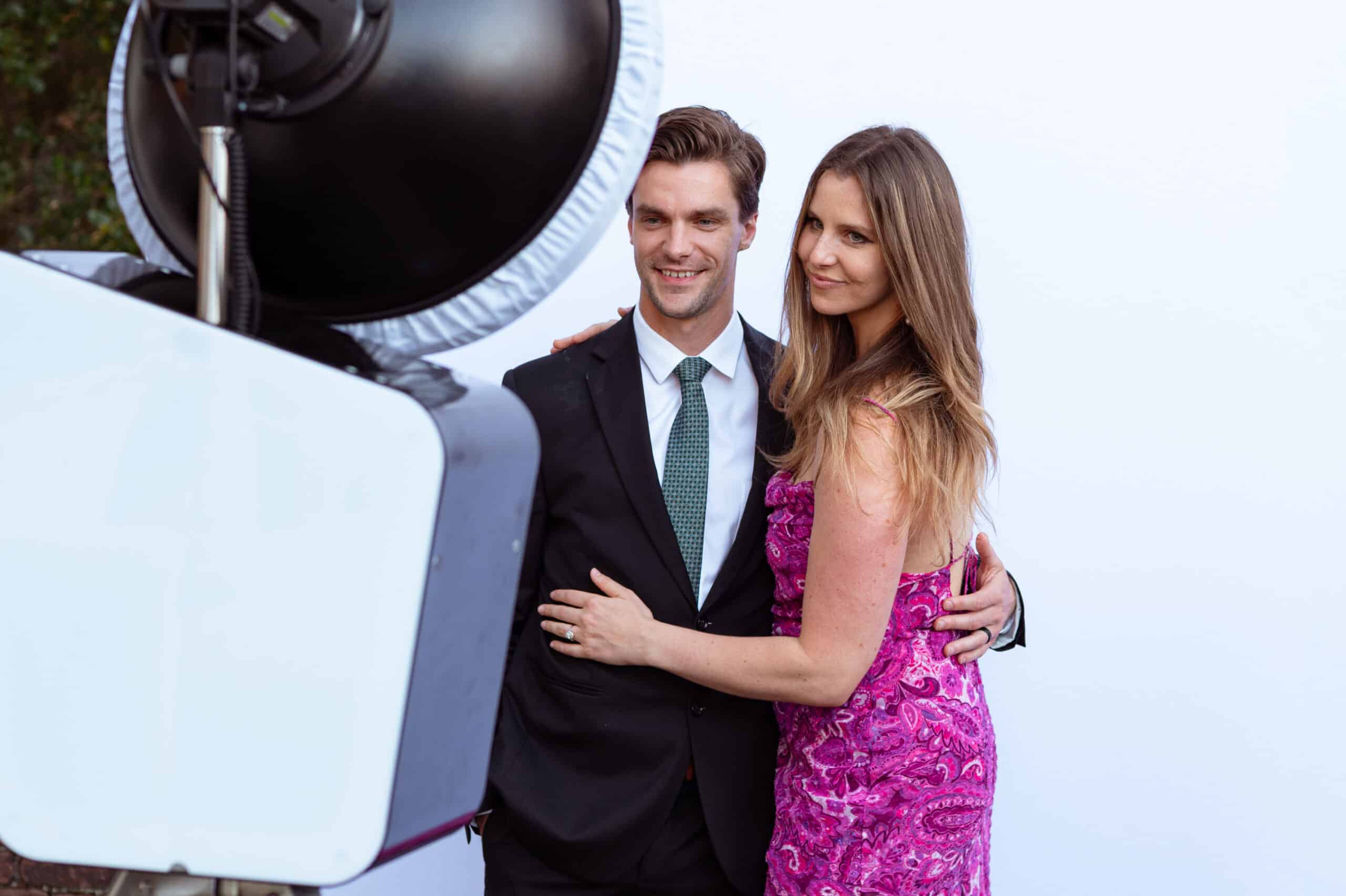 Glam Photo Booth experience with guests posing and professional lighting setup