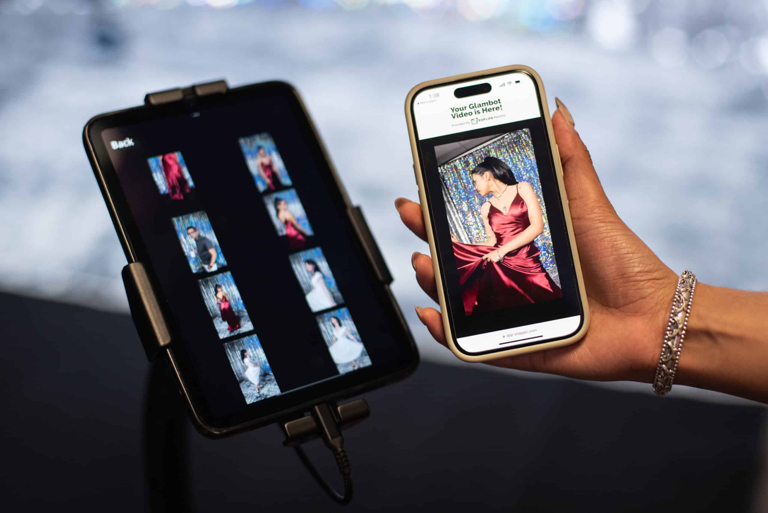 Glambot video booth display and phone showing slow-motion video captures.