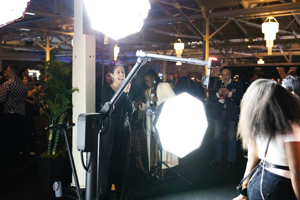 a photographer directing guests for their Glambot experience