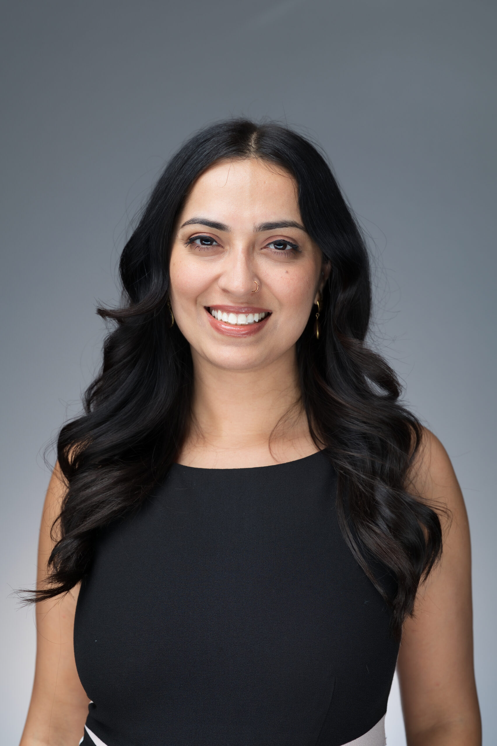 Professional headshot portrait of a smiling woman, Pop Life Photo on-site photography service.