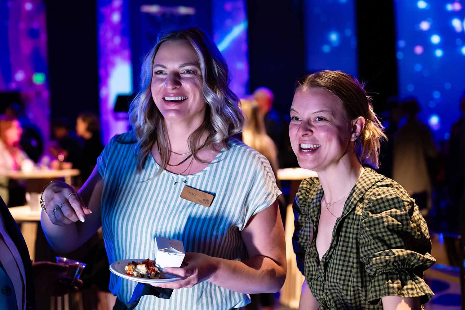 Guests laughing and connecting at an event, Pop Life Photo creating shareable moments.