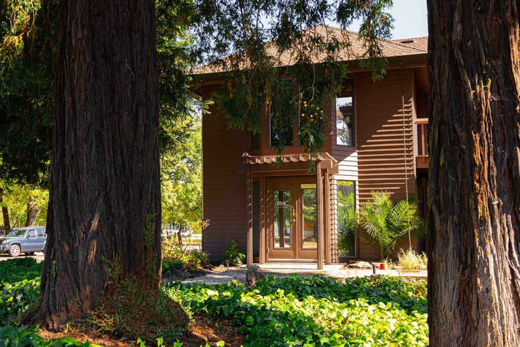 New RMC office building in Sonoma, surrounded by trees and greenery, reflecting corporate expansion into wine country.