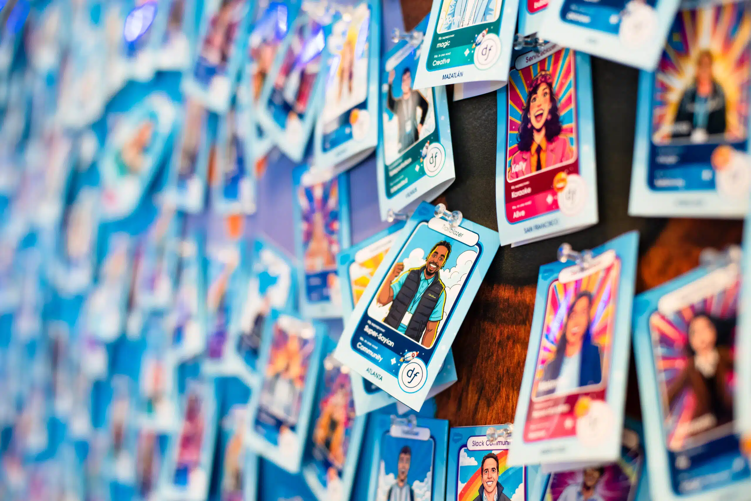 AI-powered trading cards displayed at Dreamforce event, featuring colorful illustrations of attendees and branding elements, capturing guest engagement and interactive experience.