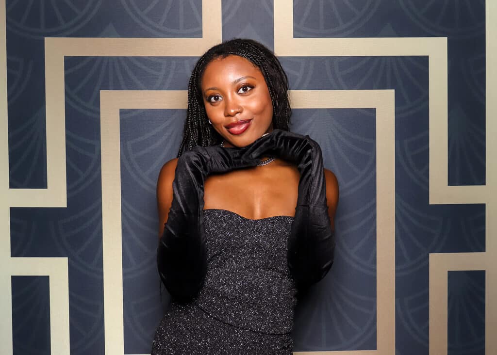 a woman posing for an elegant portrait with the Pop Life Photo Glam Booth