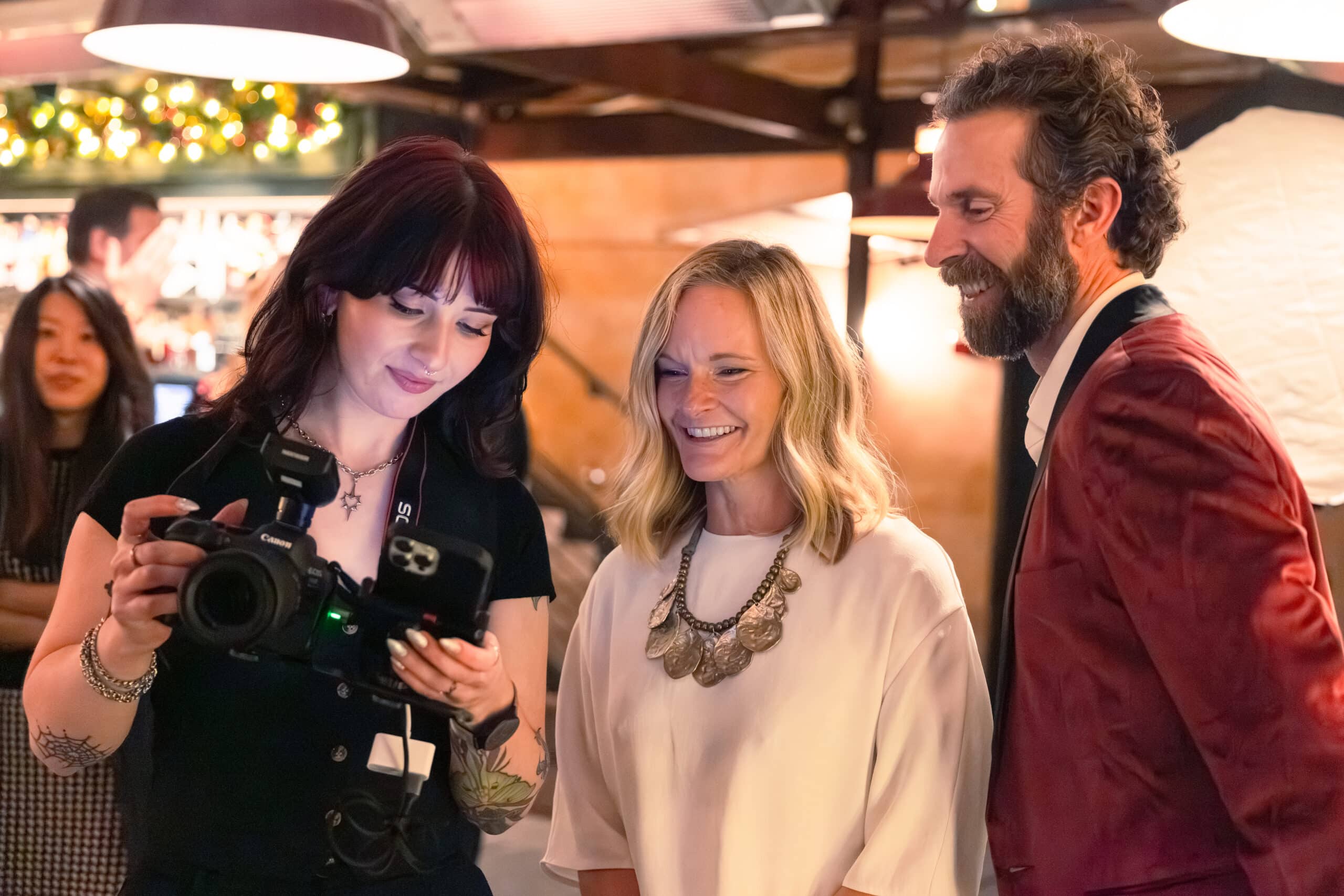 Pop Life photographer capturing candid moments and connections at an event.