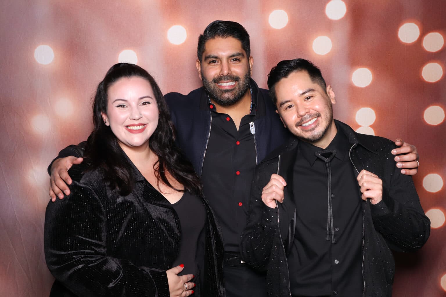 Festive lights photo booth backdrop with smiling people, Pop Life Photo booth experience.