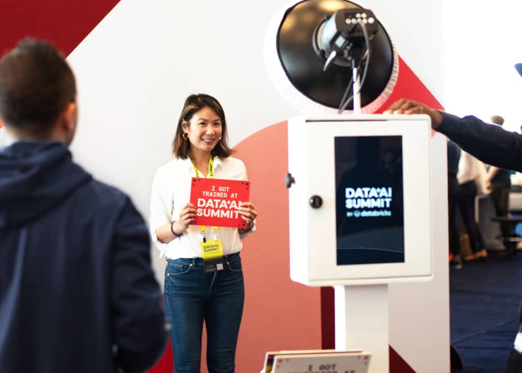 Branded corporate photo booth with Data AI Summit signage and customized digital experience.