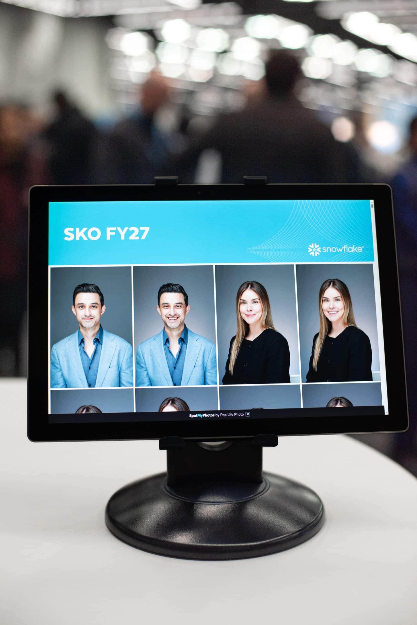 On-site headshot studio display showcasing instant digital delivery for Snowflake corporate event.