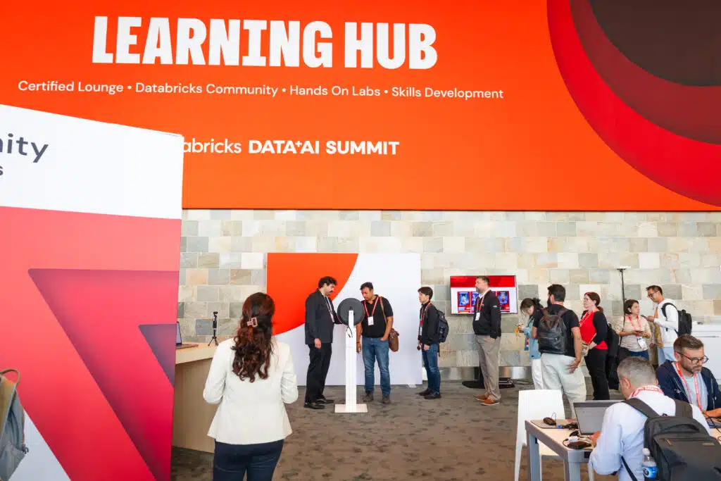Databricks Data + AI Summit activation with custom AI trading cards and a learning hub